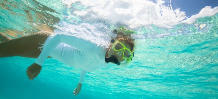 Girl is snorkeling